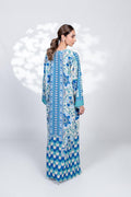 Woman wearing a blue and white patterned dress on a white background